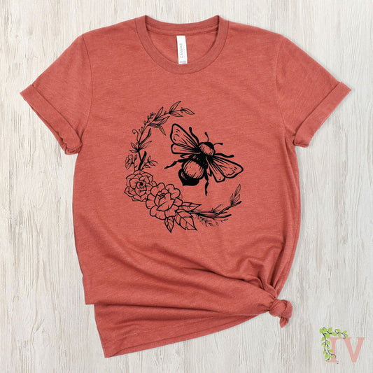 Bee with a flower border screen print transfer, which is made from black plastisol ink