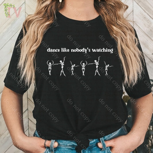 Dancing Skellys T-shirt displaying 6 cute skeleton dancers and a quote.